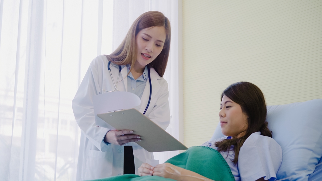 A female doctor consulting her female patient